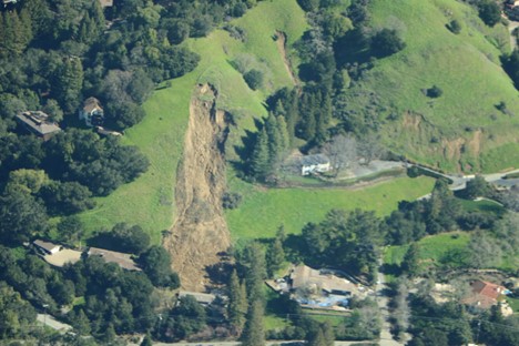 Landslide scar on a grassy slope